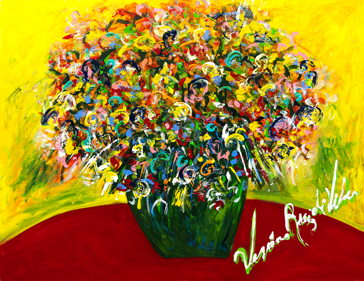 Mami Flores — by Veronica Ruiz de Velasco: a dome-shaped bouquet of teal ribbons and pink rosettes in a dark green vase on yellow above a red band